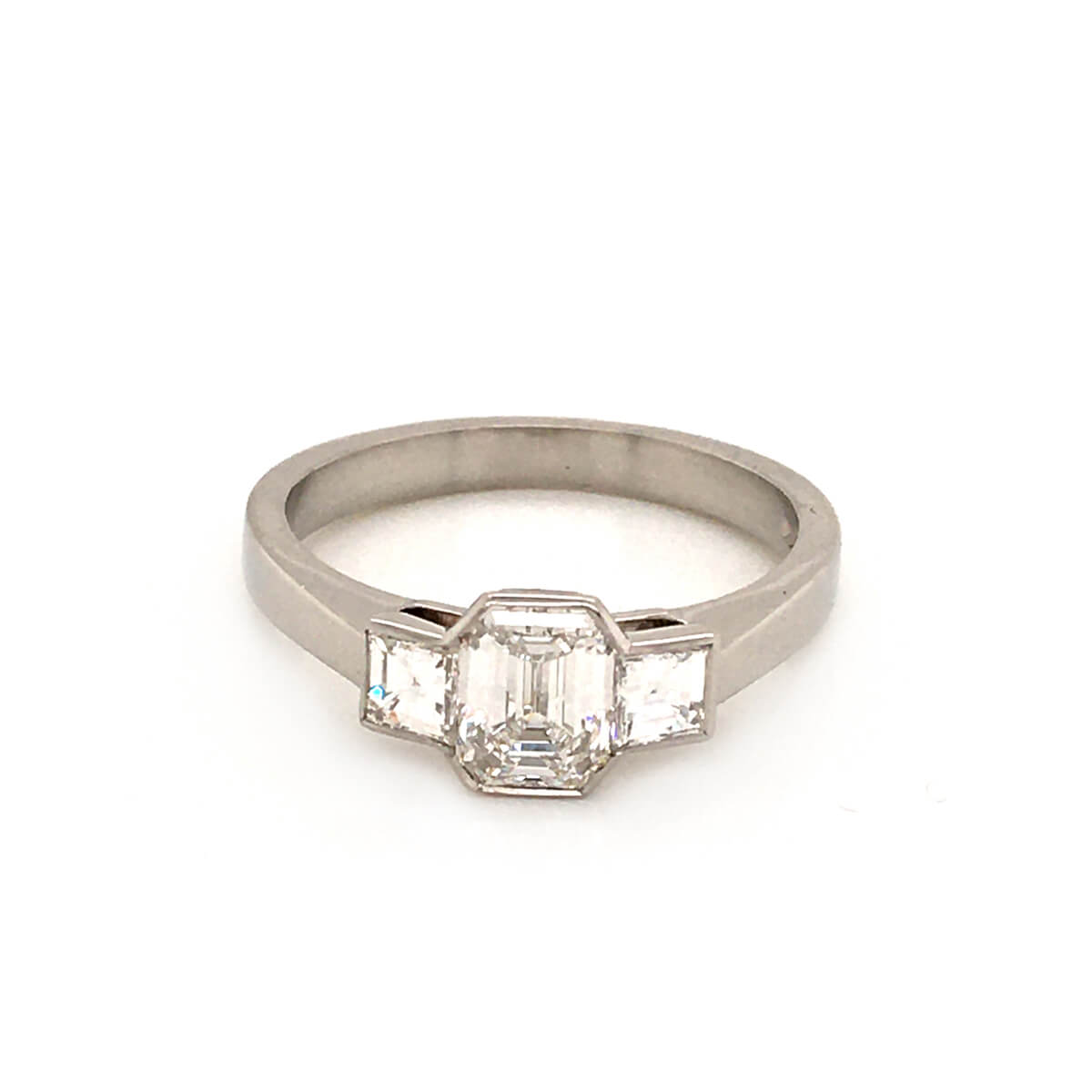 emerald cut diamond trilogy ring